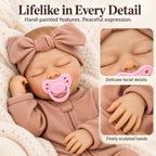TOLIKE 18-Inch Sleeping Reborn Baby Doll in Pink Sleeper & Bow
